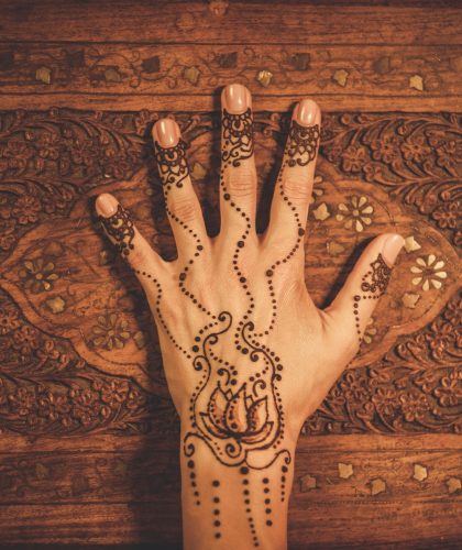 Woman's hand with traditional menhdi henna ornament